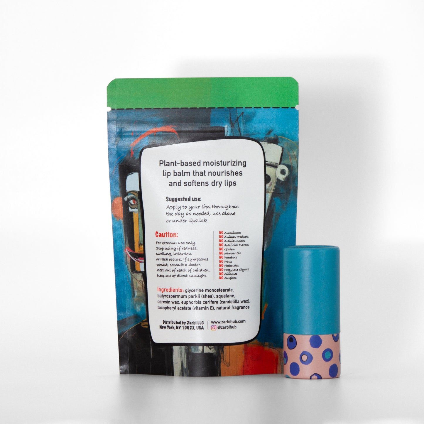 Twist-up Verbena lip balm tube with light blue cap, pink base, irregular blue circle pattern. Back side of stand-up blue tear-off pouch with ingredients, instructions, Zarbi contact info.