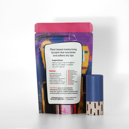 Twist-up Sea Buckthorn lip balm tube with blue cap, tan base, black irregular rectangle pattern. Back side of stand-up purple tear-off pouch with ingredients, instructions, Zarbi contact info.