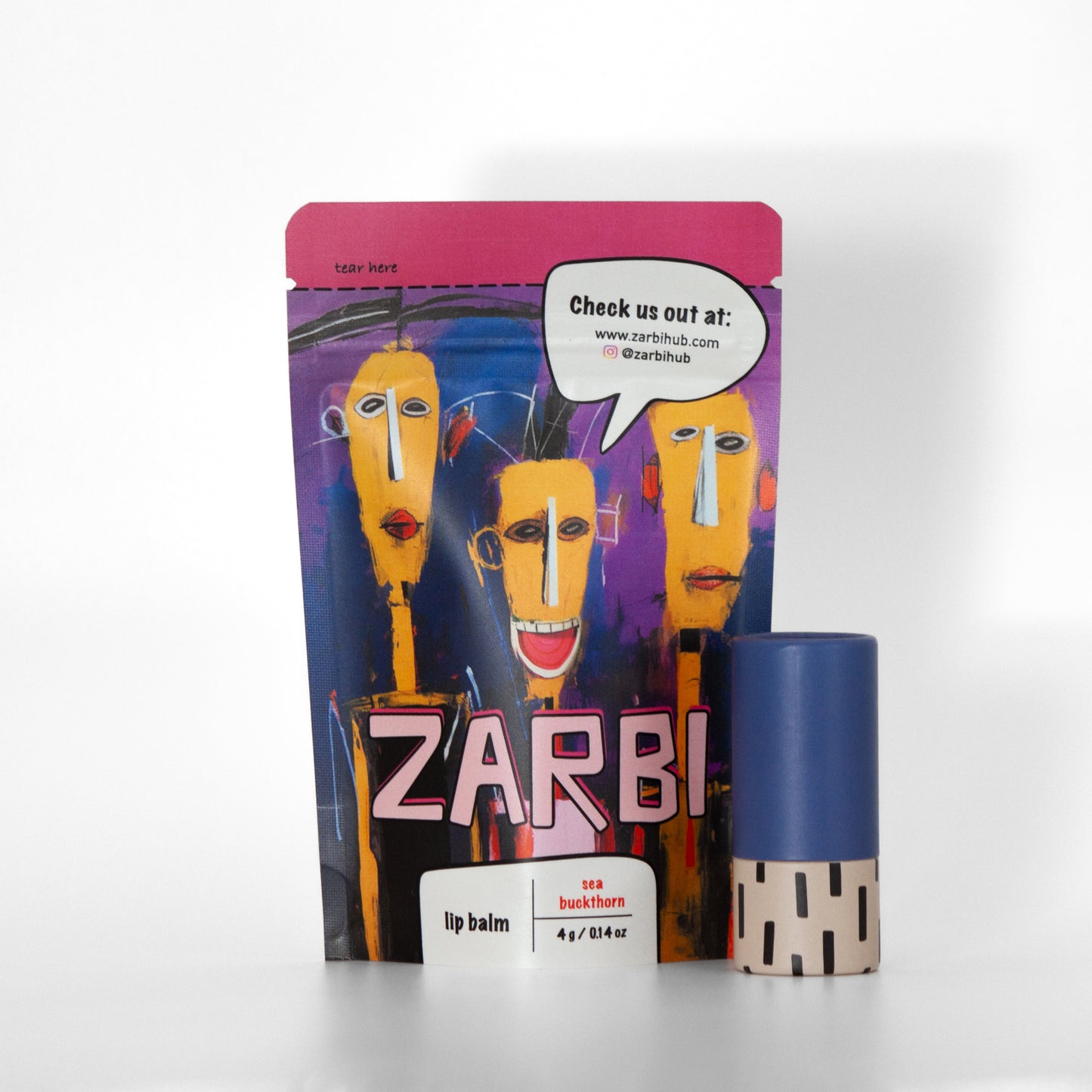 Twist-up Sea Buckthorn lip balm tube with blue cap, tan base, black irregular rectangle pattern, 0.14 net oz. Stand-up purple tear-off pouch with 3 orange-faced cartoon figures, Zarbi logo, speech bubble with social media info.