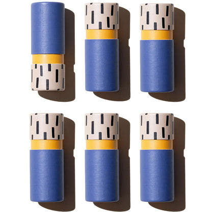 Graphic flat lay of Zarbi vegan lip balms in matte blue tubes with speckled black-and-beige bases and orange inner accents, arranged in a symmetrical grid on a white background.